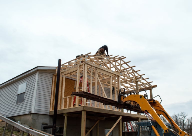Carpenters working on new roof construction