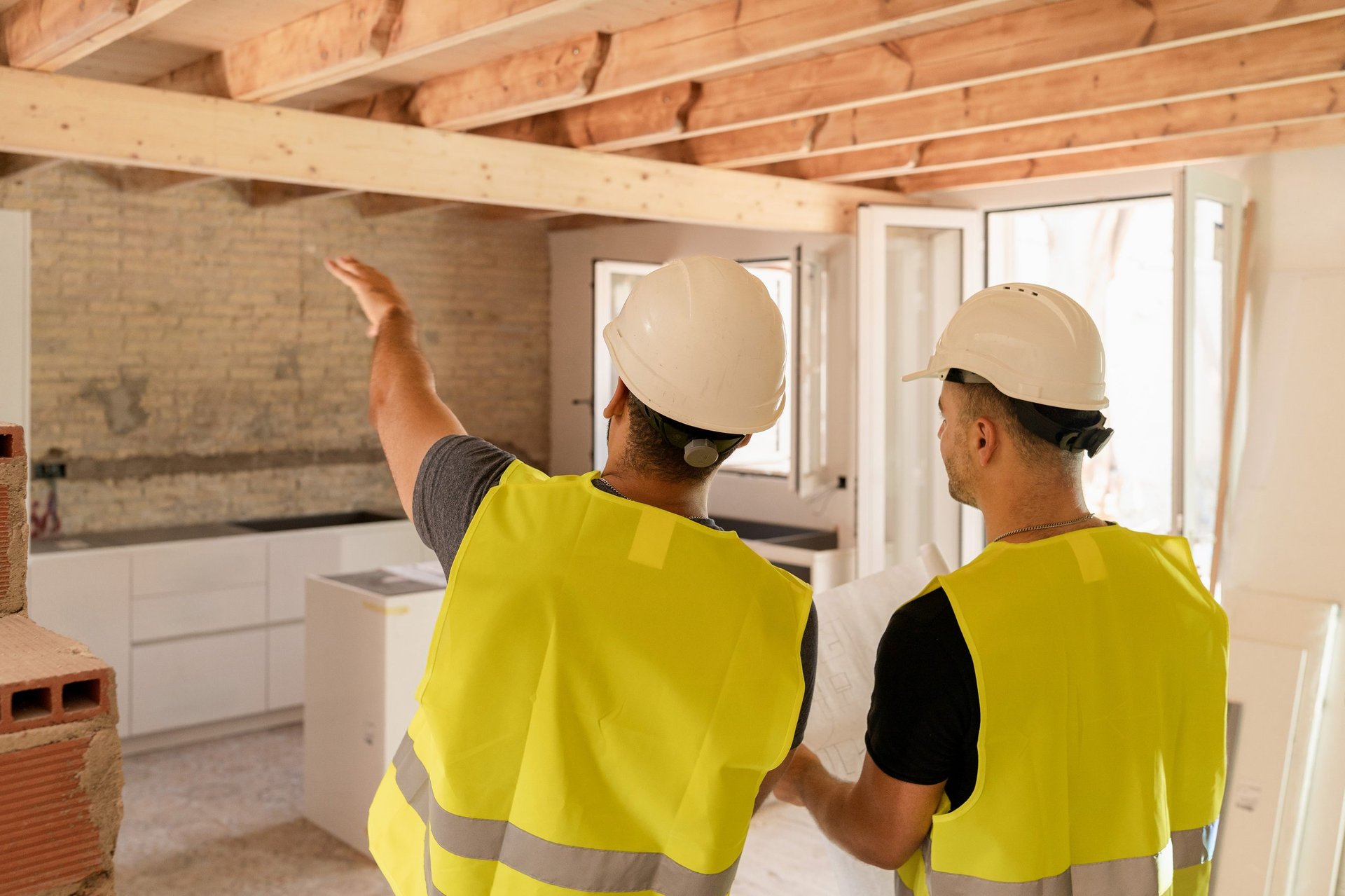 Construction workers renovating a house